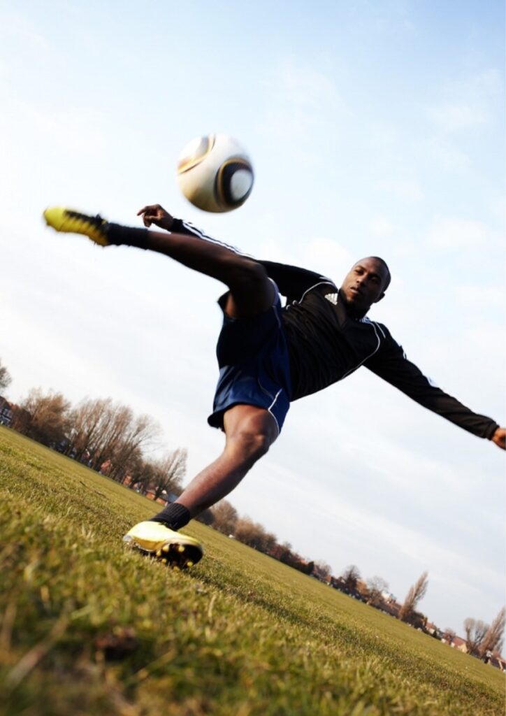 an man playing football